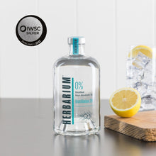 Load image into Gallery viewer, Herbarium Distillation 29 alcohol free gin 70cl bottle with glass, ice and lemons with IWSC silver medal award
